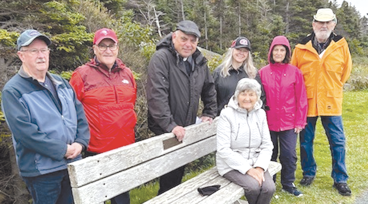 people enjoying a break while on a prayer walk in Upper Gullies, Newfoundland.